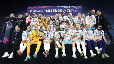 San Diego Wave players and coaches pose for a team photo after winning the 2024 NWSL Challenge Cup.