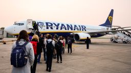 Passengers wait to board an aircraft of low cost Irish airline Ryanair at Treviso's Antonio Canova airport on March 17, 2024. (Photo by John MACDOUGALL / AFP) (Photo by JOHN MACDOUGALL/AFP via Getty Images)