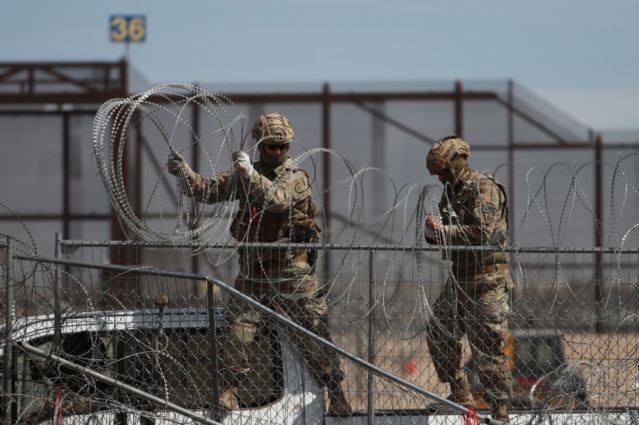 Border patrol officers pull barbed wires in Ciudad Juarez, Mexico, on March 20, 2024.