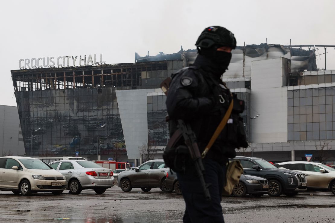 A law enforcement officer patrols the scene of the gun attack on Saturday.