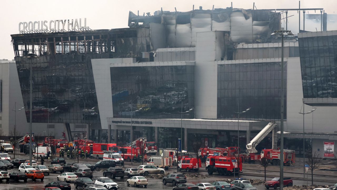TOPSHOT - Members of emergency services work at the scene of the gun attack at the Crocus City Hall concert hall in Krasnogorsk, outside Moscow, on March 23, 2024. Gunmen who opened fire at a Moscow concert hall killed more than 60 people and wounded over 100 while sparking an inferno, authorities said on March 23, 2024, with the Islamic State group claiming responsibility. (Photo by STRINGER / AFP) (Photo by STRINGER/AFP via Getty Images)