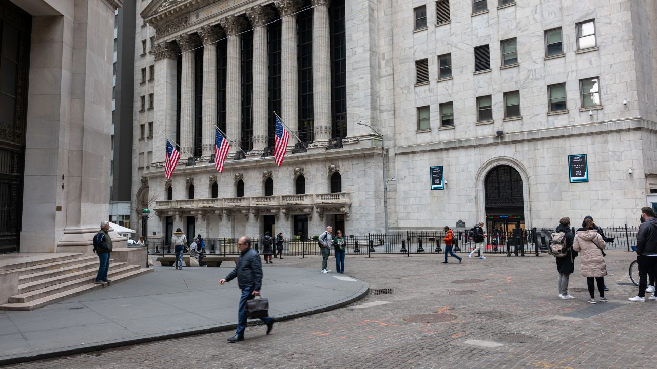 People walk by the New York Stock Exchange (NYSE) on March 20, 2024 in New York City.