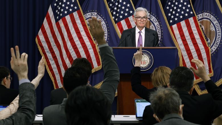 Reporters raise their hands to ask questions of Federal Reserve Bank Chair Jerome Powell during a news conference at the bank's William McChesney Martin building on March 20, 2024 in Washington, DC. Following a meeting of the Federal Open Markets Committee, Powell announced that the Fed left interest rates unchanged at about 5.3 percent, but suggested it may cut rates three times later this year as inflation eases.