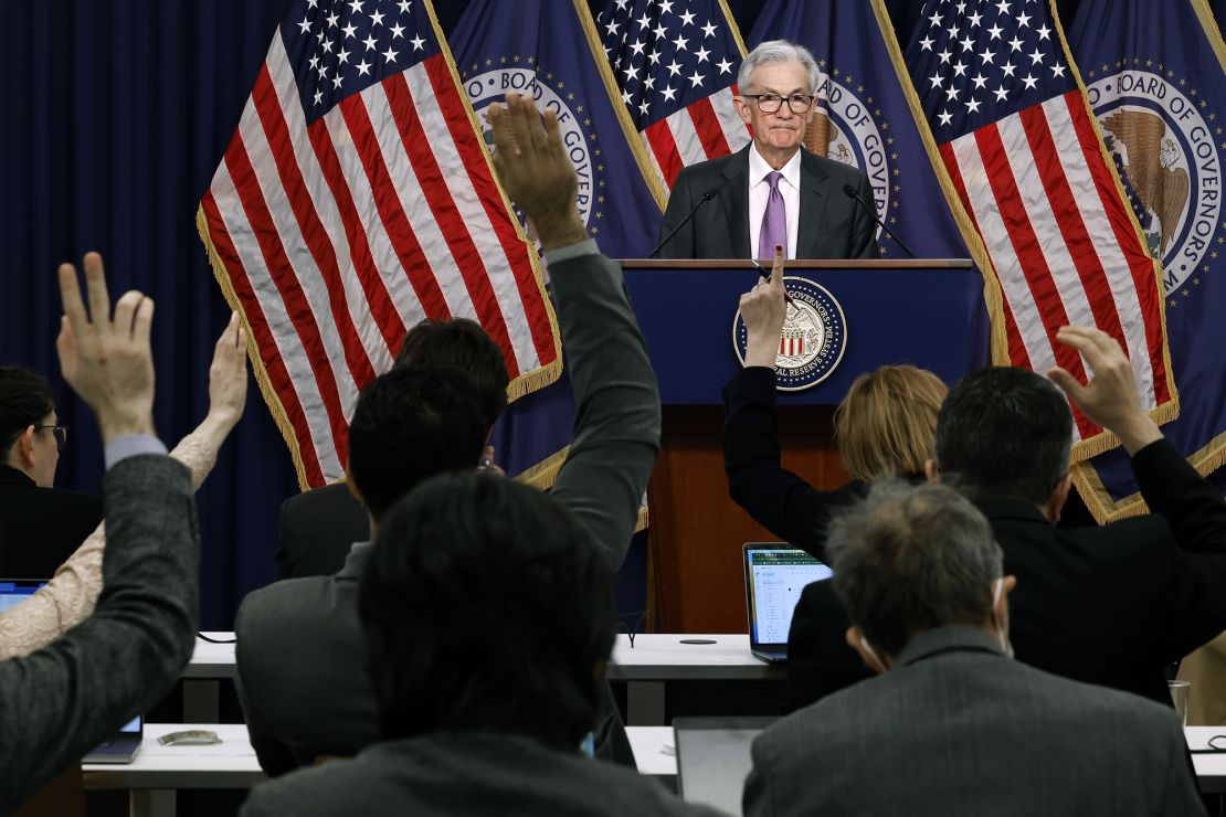 Reporters raise their hands to ask questions of Federal Reserve Chair Jerome Powell during a post-meeting press conference on March 20, 2024, in Washington, DC.