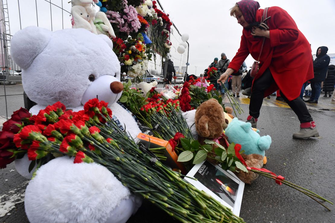 Mourners lay flowers in Moscow on Saturday for the victims of the Crocus City Hall attack.