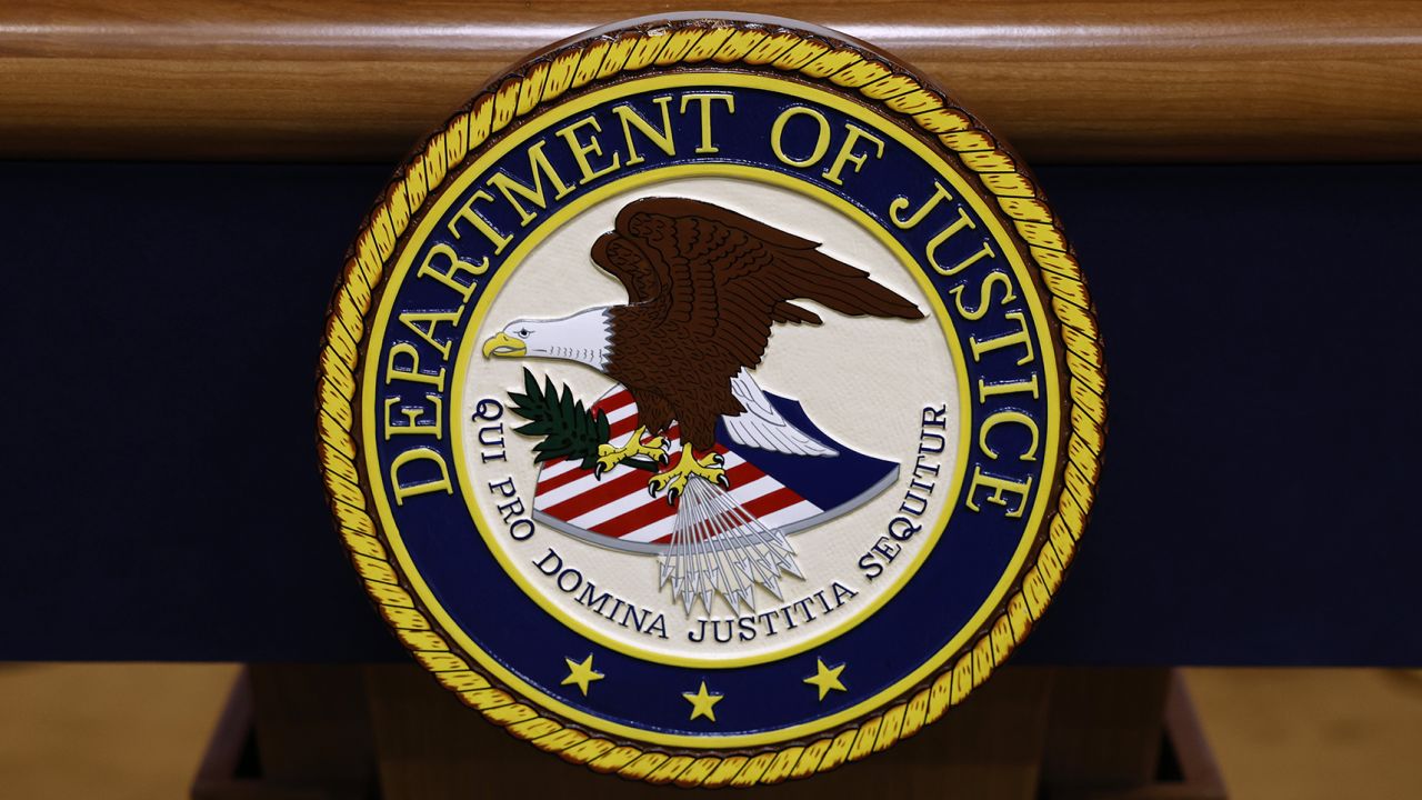 A seal for the Department of Justice.