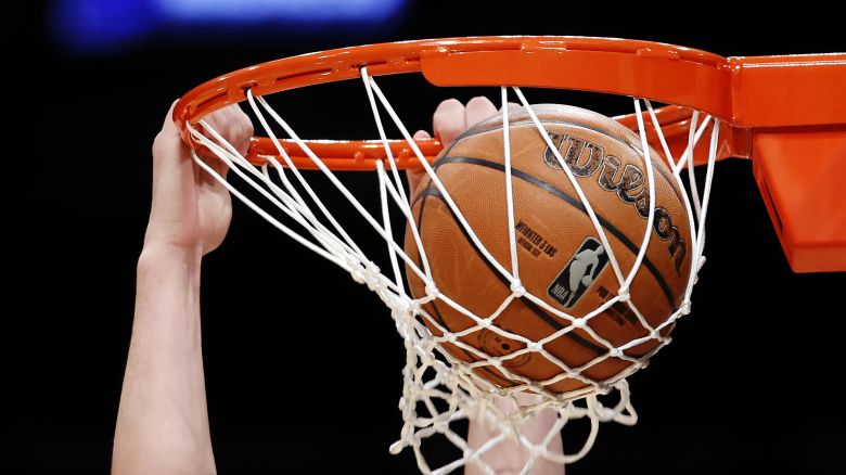 NEW YORK, NEW YORK - MARCH 21: Detail of a Wilson basketball  as it enters the hoop during a practice day ahead of the NCAA Men's Basketball Tournament at Barclays Center on March 21, 2024 in the Brooklyn borough of New York City. (Photo by Sarah Stier/Getty Images)