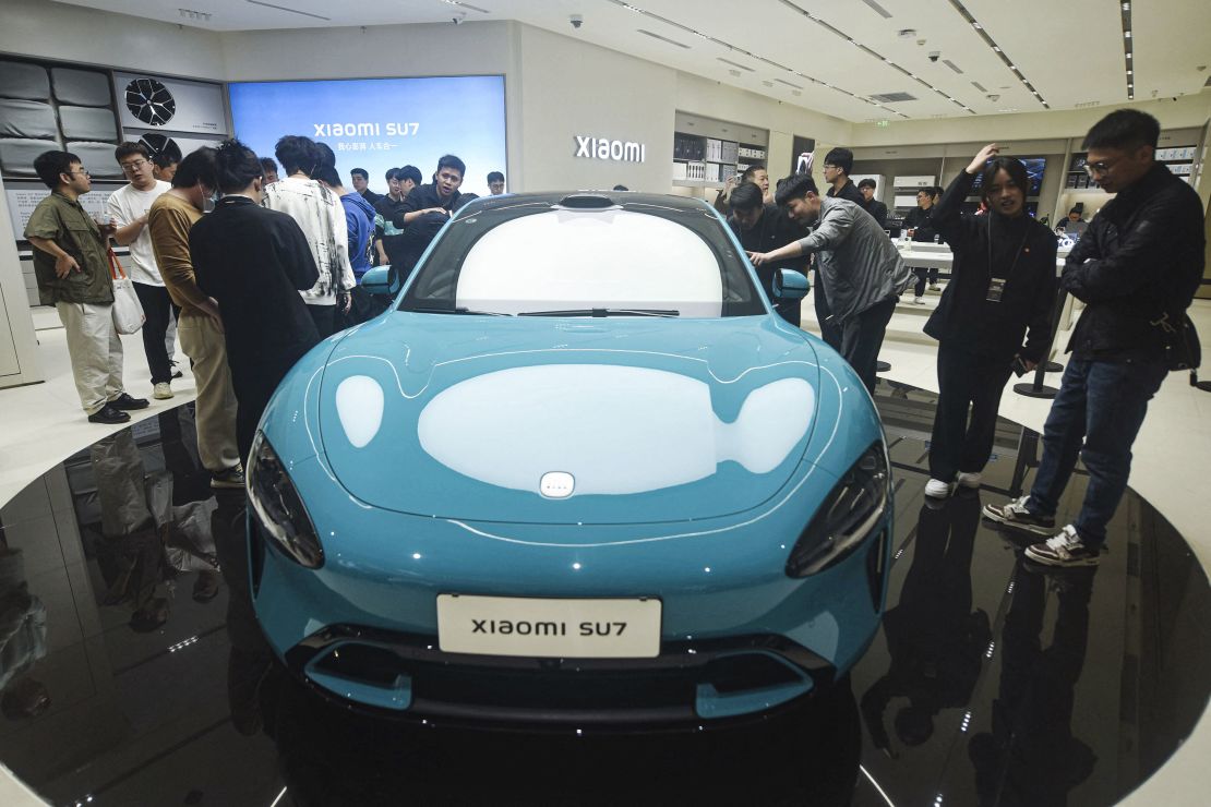 Chinese smartphone maker Xiaomi's first electric car, Xiaomi SU7 model, is seen at a shop in Hangzhou, in eastern China's Zhejiang province on March 25, 2024.