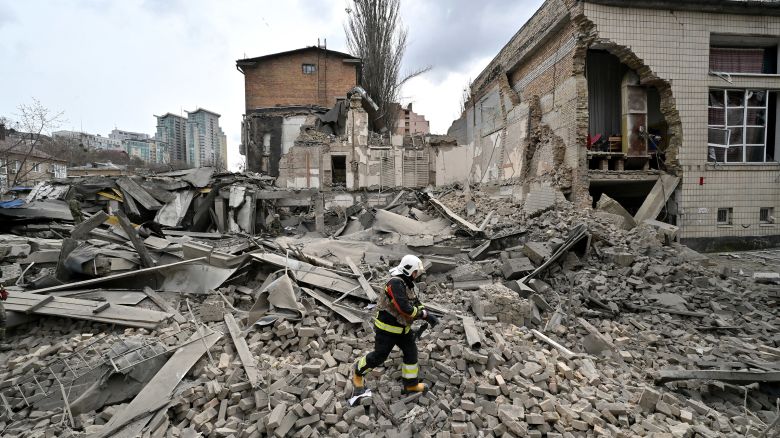 A Ukrainian rescuer works at the site of a missile attack in Kyiv, Ukraine on March 25, 2024.