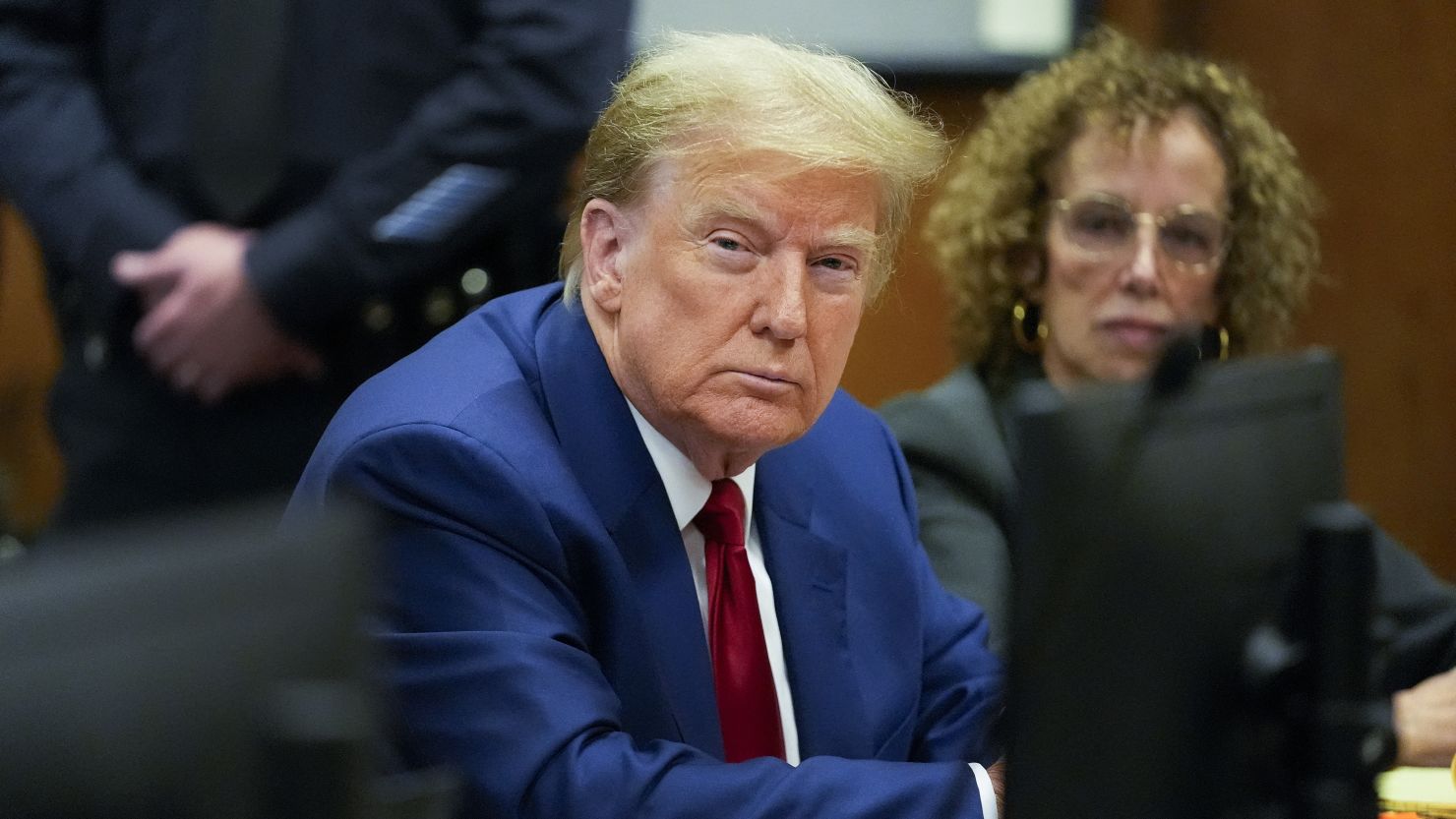 Former US President Donald Trump and attorney Susan Necheles attend a hearing at Manhattan Criminal Court in New York City on March 25.