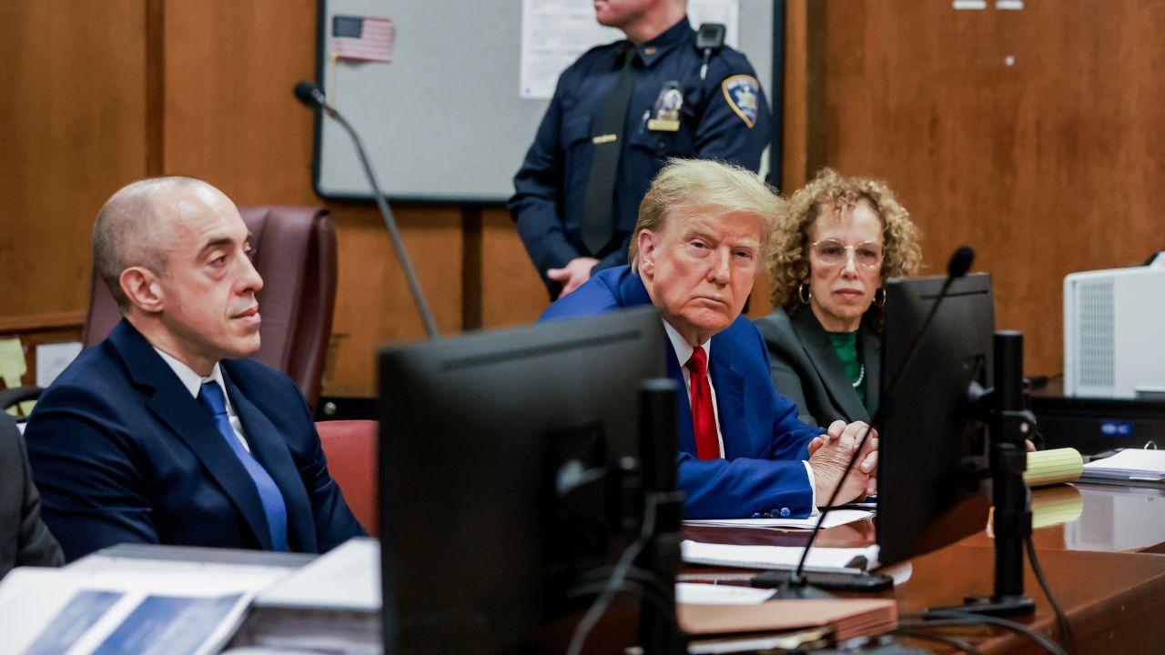 Former US President Donald Trump, center right, and Susan Necheles, attorney for former US President Donald Trump, right, in a courtroom at Manhattan criminal court in New York, US, on Monday, March 25, 2024. Trump is in court for a high-stakes hearing on his last-ditch bid to dismiss charges brought by Manhattan District Attorney Alvin Bragg, who accused Trump of falsifying business records to disguise hush money payments to a porn star before the 2016 election. Photographer: Justin Lane/EPA/Bloomberg via Getty Images