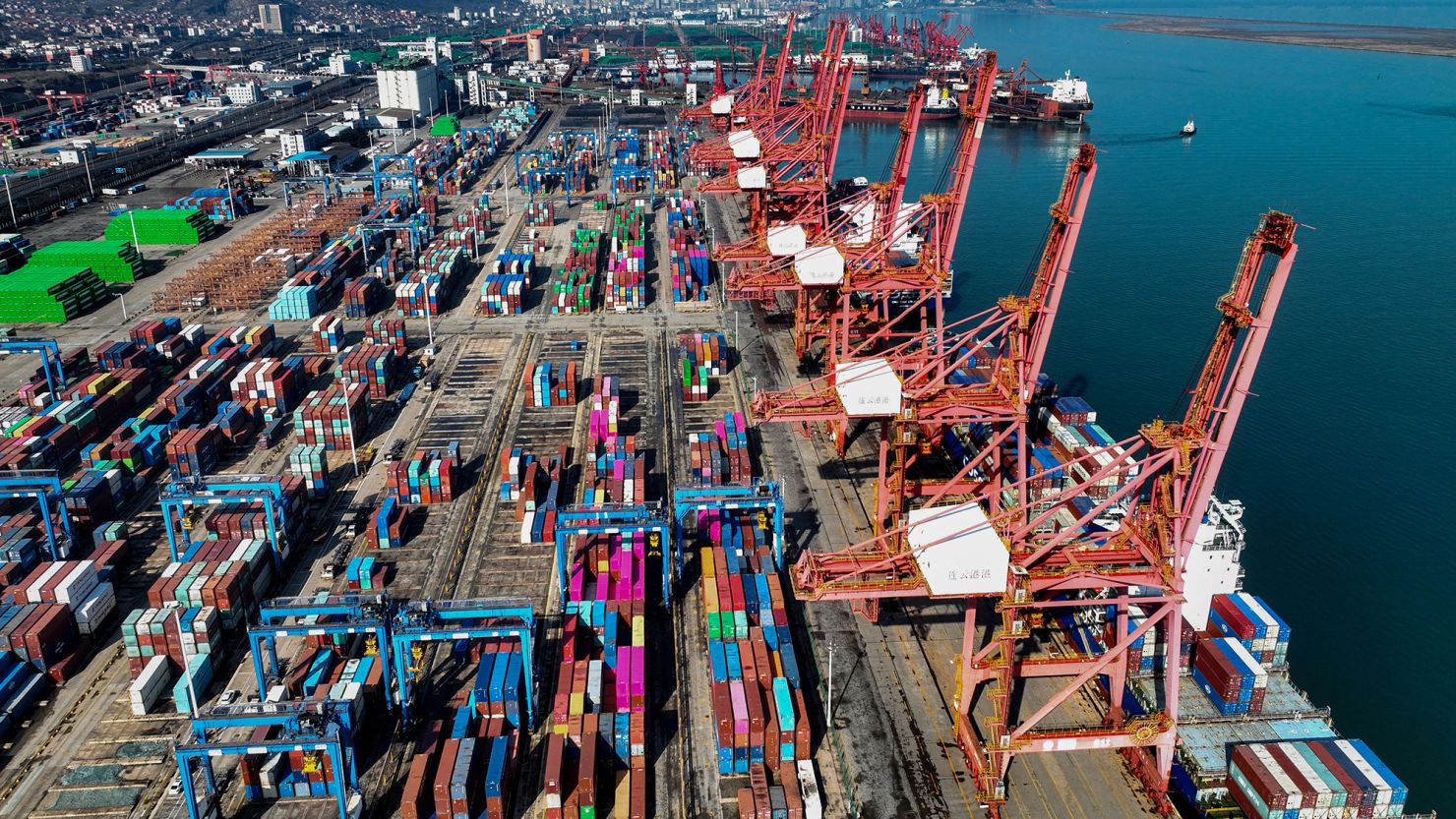 Shipping containers stacked at the Lianyungang Port in eastern China's Jiangsu province on March 26, 2024.