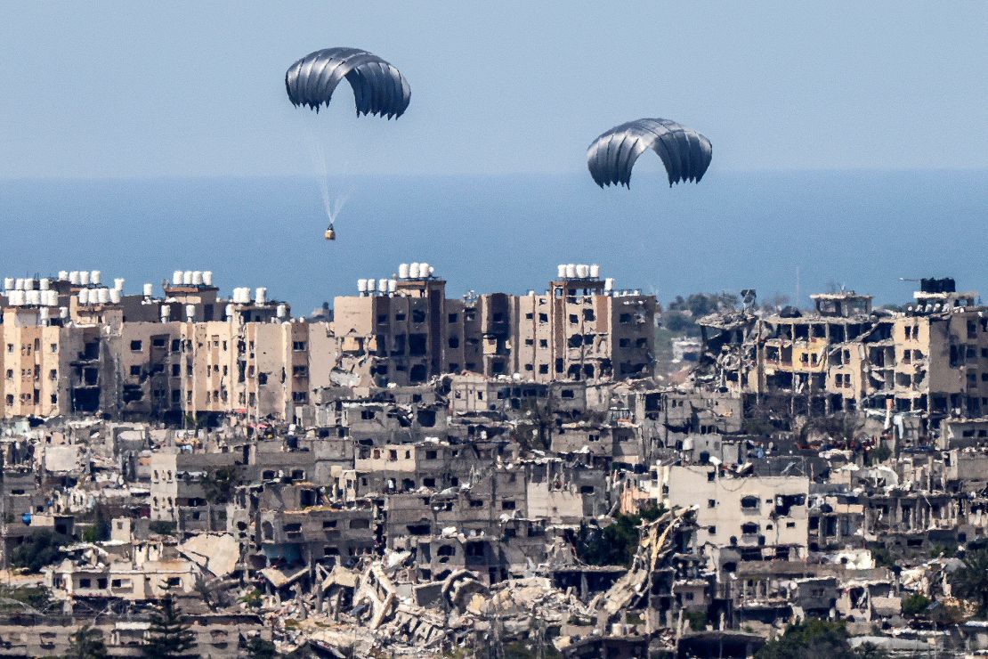 This picture taken from Israel's southern border with the Gaza Strip shows parachutes of humanitarian aid dropping over the besieged Palestinian territory in late March.