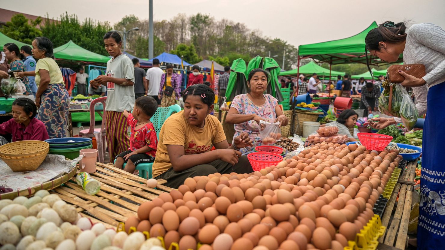 Vendors wait to sell eggs to customers at Myo Ma market in Naypyidaw on March 26, 2024.
