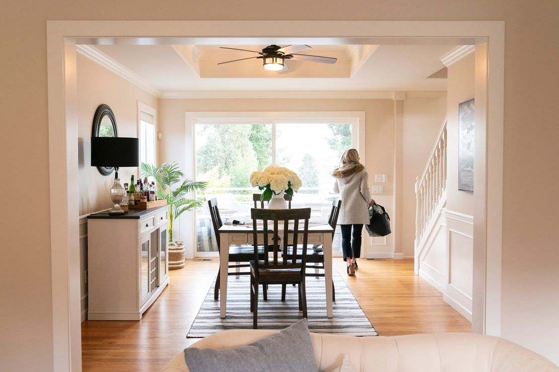 A realtor walks through the dining room at an open house on March 26, 2024 in Seattle, Washington. The National Association of Realtors has agreed to settle a lawsuit over commission rules for national real estate agents. to potential changes in the way Americans buy and sell homes.