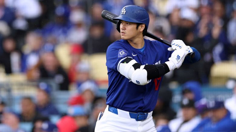 LOS ANGELES, CALIFORNIA - MARCH 24: Shohei Ohtani #17 of the Los Angeles Dodgers on deck during the first inning in a preseason game against the Los Angeles Angels at Dodger Stadium on March 24, 2024 in Los Angeles, California. (Photo by Harry How/Getty Images)