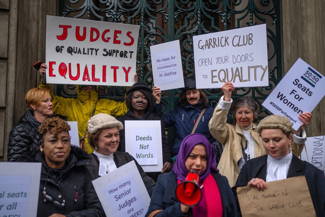 Protesters are pictured outside the Garrick Club on March 28.