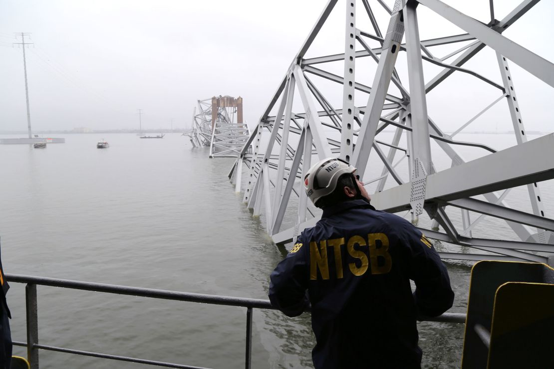 In this NTSB handout, an investigator examines the collapsed Francis Scott Key Bridge from the cargo vessel Dali on March 27 in Baltimore.