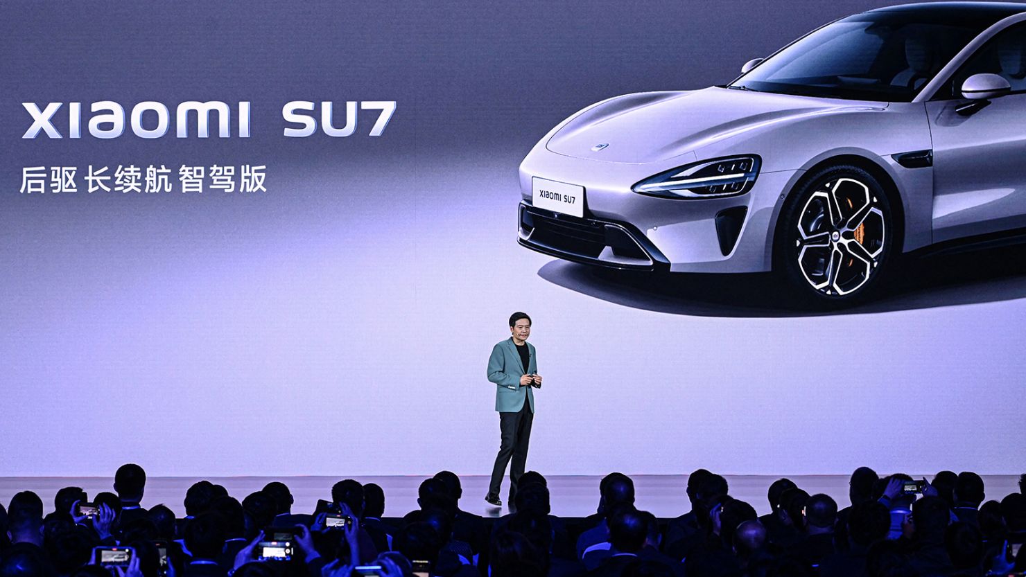 Lei Jun, Chairman and CEO of Chinese electronics company Xiaomi, presents the new electric car Xiaomi SU7 model at a launch event in Beijing on March 28, 2024.