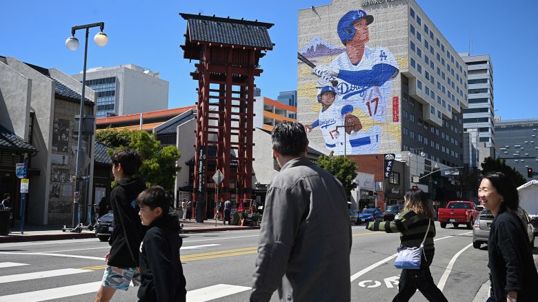 A mural showing Los Angeles Dodgers Japanese player Shohei Ohtani is seen on the side of the Miyako Hotel in Little Tokyo in downtown Los Angeles, California, on March 28, 2024. The mural, by artist Robert Vargas, is 150 feet (46 meters) tall and is titled "LA Rising." (Photo by Robyn Beck / AFP) / RESTRICTED TO EDITORIAL USE - MANDATORY MENTION OF THE ARTIST ROBERT VARGAS UPON PUBLICATION - TO ILLUSTRATE THE EVENT AS SPECIFIED IN THE CAPTION (Photo by ROBYN BECK/AFP via Getty Images)