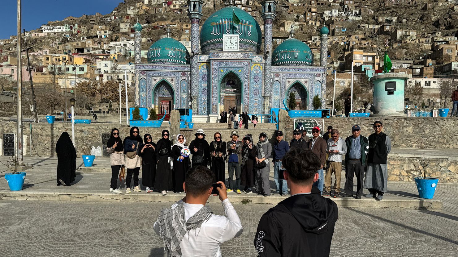 Thai tourists pose for a picture during a visit to the Kart-e-Sakhi Shrine in Kabul during a March 2024 visit.