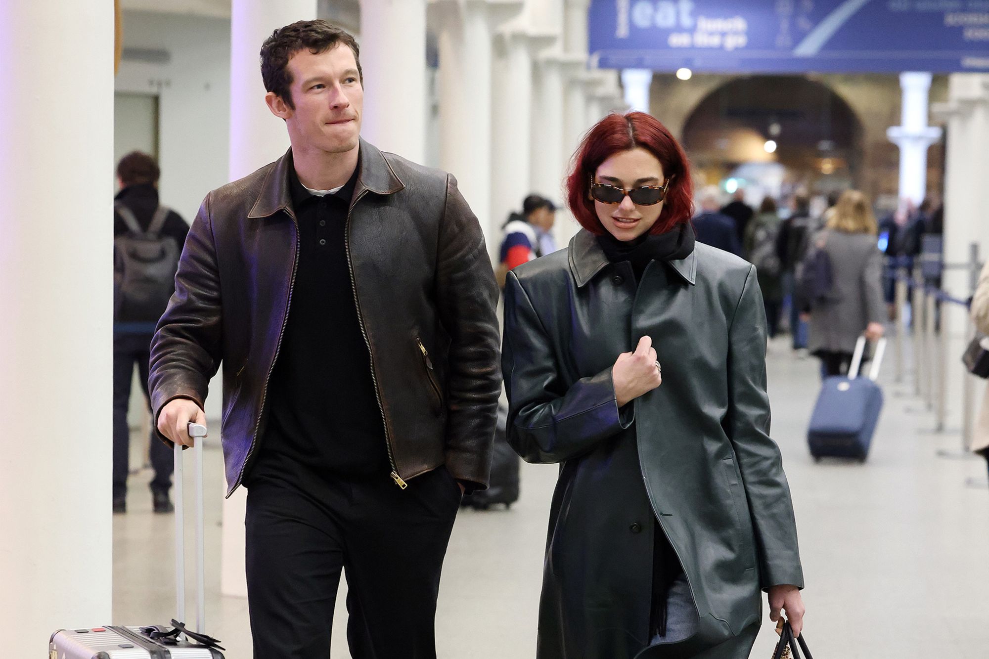 Singer Dua Lipa and actor Callum Turner both wore minimalist-style leather jackets arriving at London St Pancras Station from Paris earlier this week, but their baggage showed a more colorful, personal side to the pair.