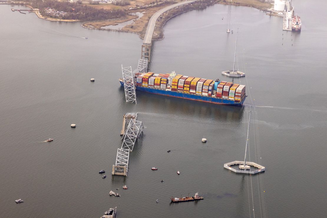 The cargo ship Dali is seen after running into and collapsing the Francis Scott Key Bridge on March 26, 2024 in Baltimore, Maryland. Rescuers are searching for at least seven people, authorities say, while two others have been pulled from the Patapsco River.