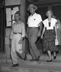 Lake County Sheriff Willis McCall (center) escorts Willie Padgett and Norma Padgett to the Office of the State Attorney for questioning on the couple's alleged attack by four Black men in 1949.