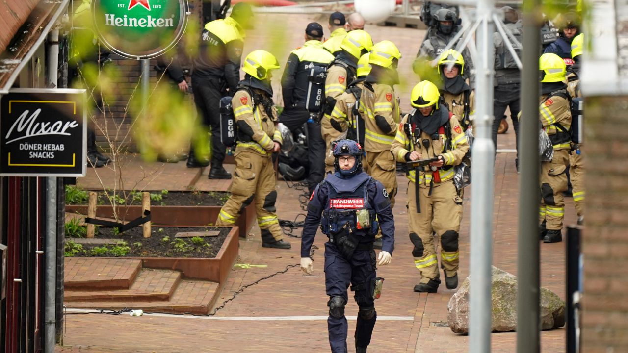 Police and emergency services are seen amid the hostage incident in Ede on Saturday.