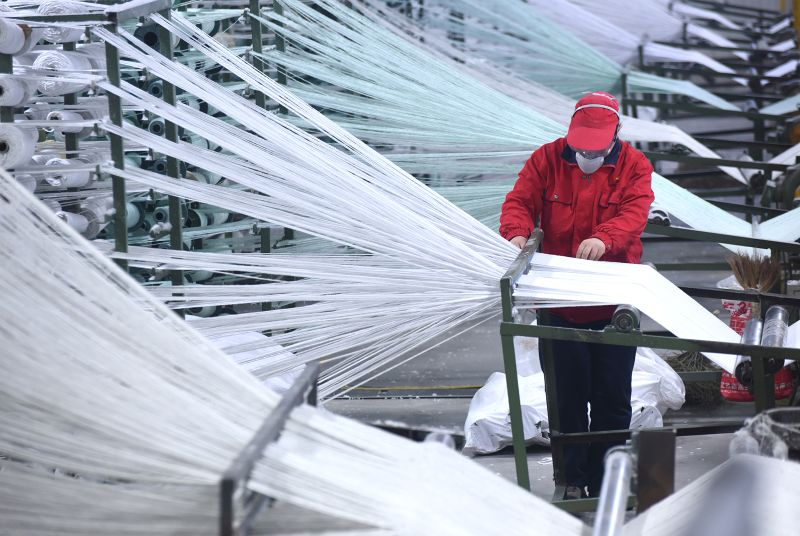 An employee working at an energy-saving materials firms in Zibo, eastern China