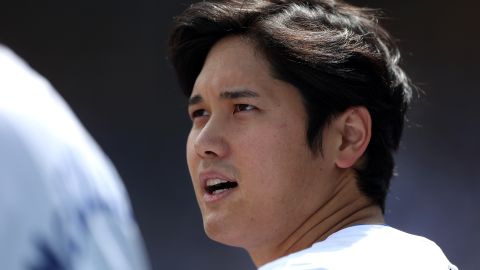 Shohei Ohtani looks on prior to making his home debut for the Los Angeles Dodgers in a game against the St. Louis Cardinals.