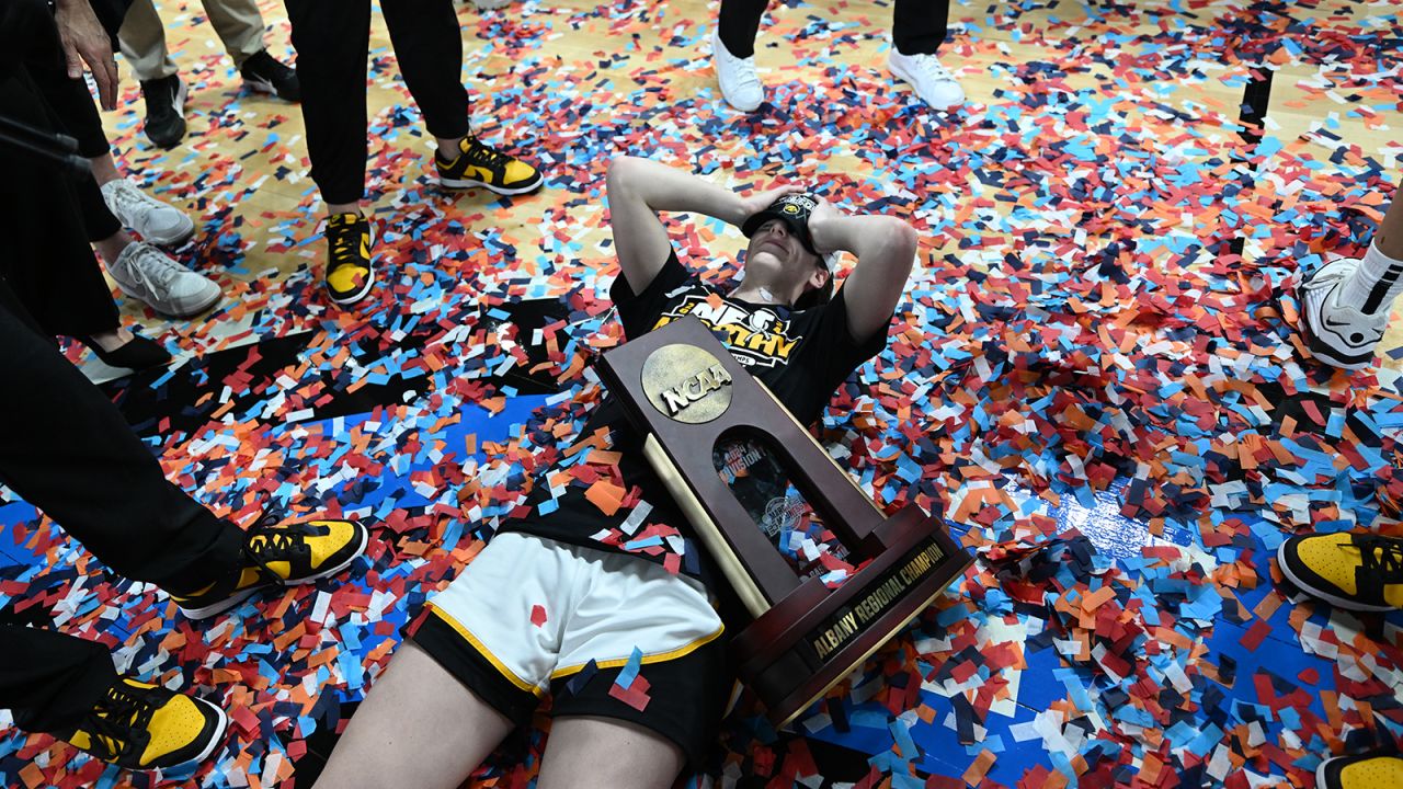 Caitlin Clark of the Iowa Hawkeyes celebrates on the court after defeating the LSU Tigers during the Elite Eight round of the 2024 NCAA women's basketball tournament held at MVP Arena.