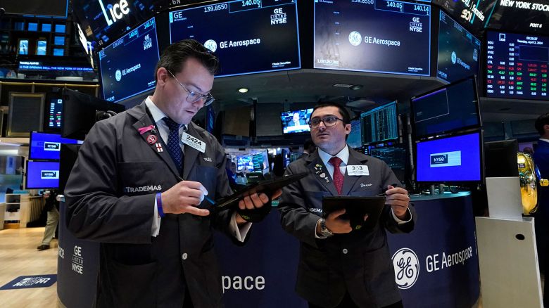 Traders work on the floor of the New York Stock Exchange (NYSE) at the opening bell on April 2, 2024, in New York City. GE is opening a new chapter in its history on April 2, its break-up into three independent entities. The initial split took place in January 2023 with the creation of GE HealthCare. The official finalization of the separation comes with GE disappearing in favor of GE Vernova, dealing with energy activities; and GE Aerospace, the new name of the late GE. (Photo by TIMOTHY A. CLARY / AFP) (Photo by TIMOTHY A. CLARY/AFP via Getty Images)