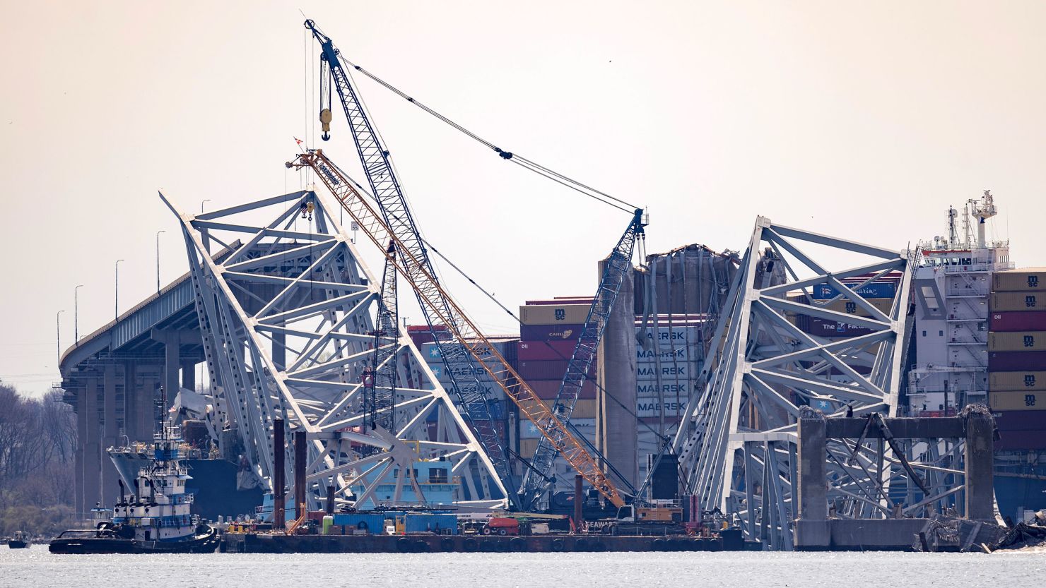 Debris is cleared from the collapsed Francis Scott Key Bridge as efforts begin to reopen the Port of Baltimore on March 31, 2024.