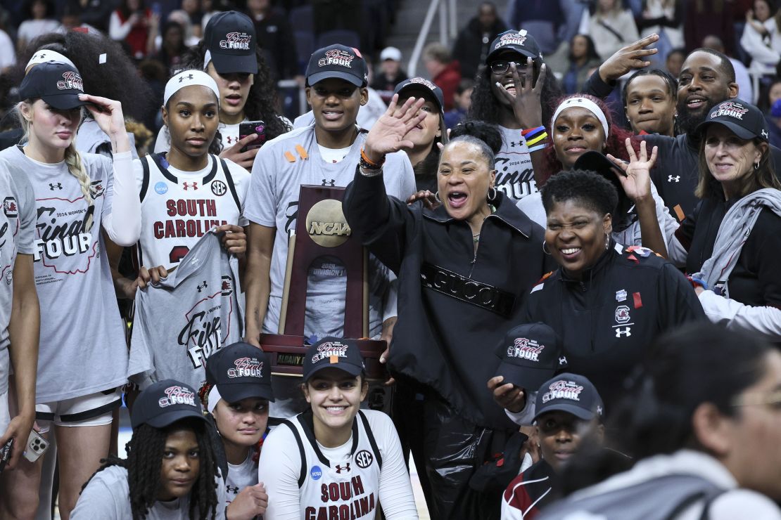 South Carolina head coach Dawn Staley celebrates with the team after beating the Oregon State Beavers in the Elite Eight round.