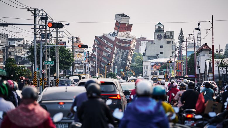 Traffic builds in front of a damaged building in Hualien following this week's deadly earthquake.