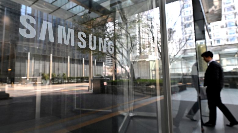 A man walks past the Samsung logo at the company's Seocho building in Seoul, South Korea.