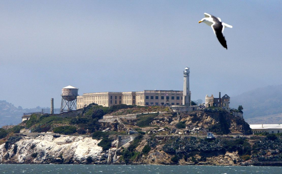 A seagull flies over Alcatraz Federal Penitentiary on Alcatraz Island on July 2, 2003.