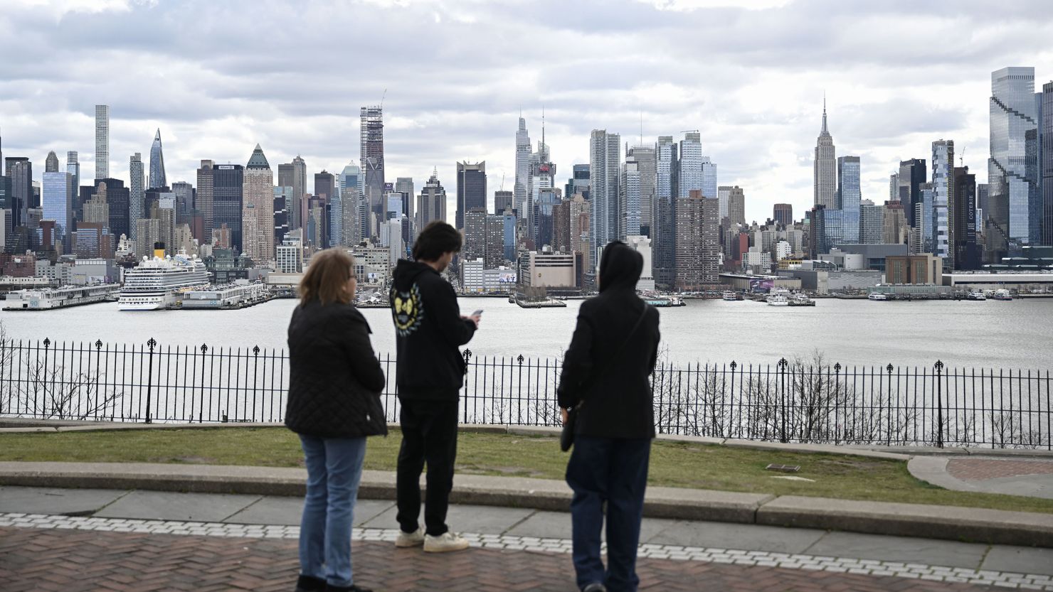 People wait outside after a 4.8 magnitude earthquake shook New York City on Friday.