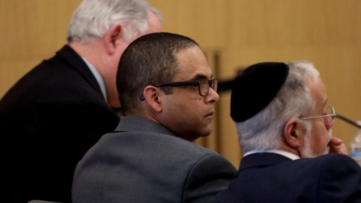 Eddie F. Gonzalez, 51, center, with lead attorney Michael Schwartz, right, and investigator Robert Dean, listen as a witness testifies during opening day proceedings in the trial of People vs. Eduardo Gonzalez in Dept. 21 at the Gov. George Deukmejian Courthouse in Long Beach on April 4, 2024.