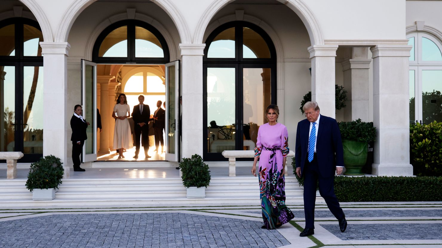Former President Donald Trump arrives at the home of billionaire investor John Paulson for a fundraising dinner. (Photo by Alon Skuy/Getty Images)