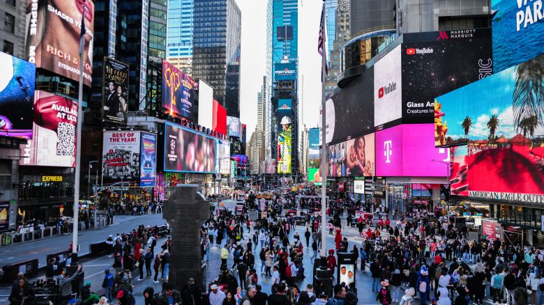 A general view shows visitors and tourists making their way through Times Square in New York City on April 7, 2024. (Photo by Charly TRIBALLEAU / AFP) (Photo by CHARLY TRIBALLEAU/AFP via Getty Images)