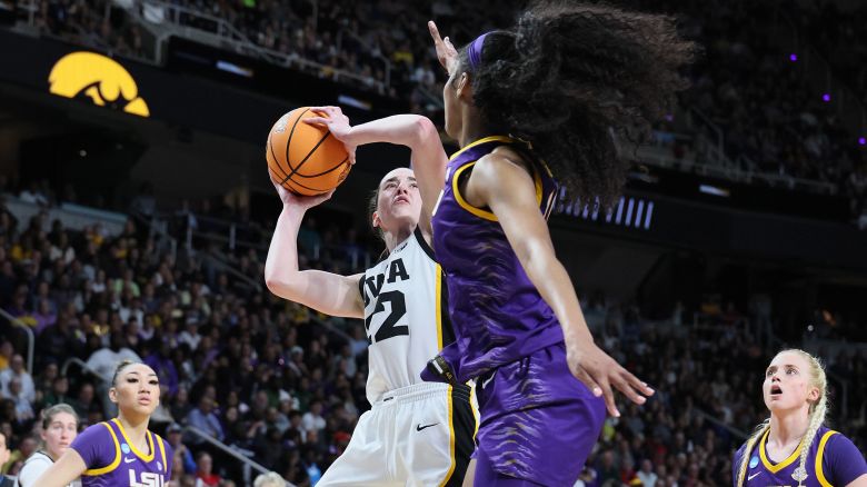 ALBANY, NEW YORK - APRIL 01: Caitlin Clark #22 of the Iowa Hawkeyes shoots the ball while defended by Angel Reese #10 of the LSU Tigers during the finals of the NCAA Women's Basketball Tournament - Albany Regional at MVP Arena on April 01, 2024 in Albany, New York. (Photo by Andy Lyons/Getty Images)