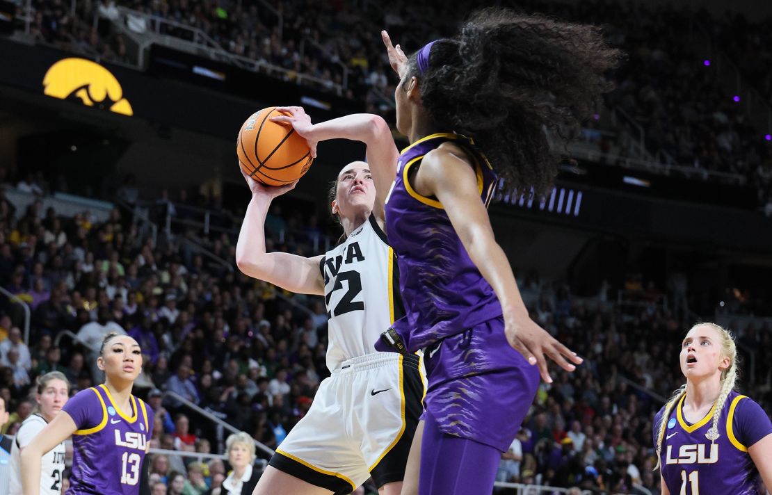 ALBANY, NEW YORK - APRIL 01: Caitlin Clark #22 of the Iowa Hawkeyes shoots the ball while defended by Angel Reese #10 of the LSU Tigers during the finals of the NCAA Women's Basketball Tournament - Albany Regional at MVP Arena on April 01, 2024 in Albany, New York. (Photo by Andy Lyons/Getty Images)