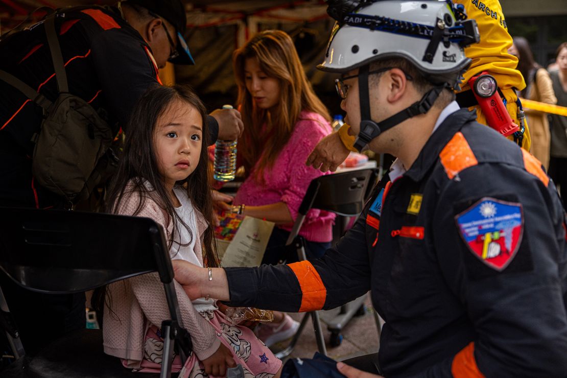 A child is given medical care at a makeshift rescue command post outside Taroko Gorge after being rescued on April 5, 2024.