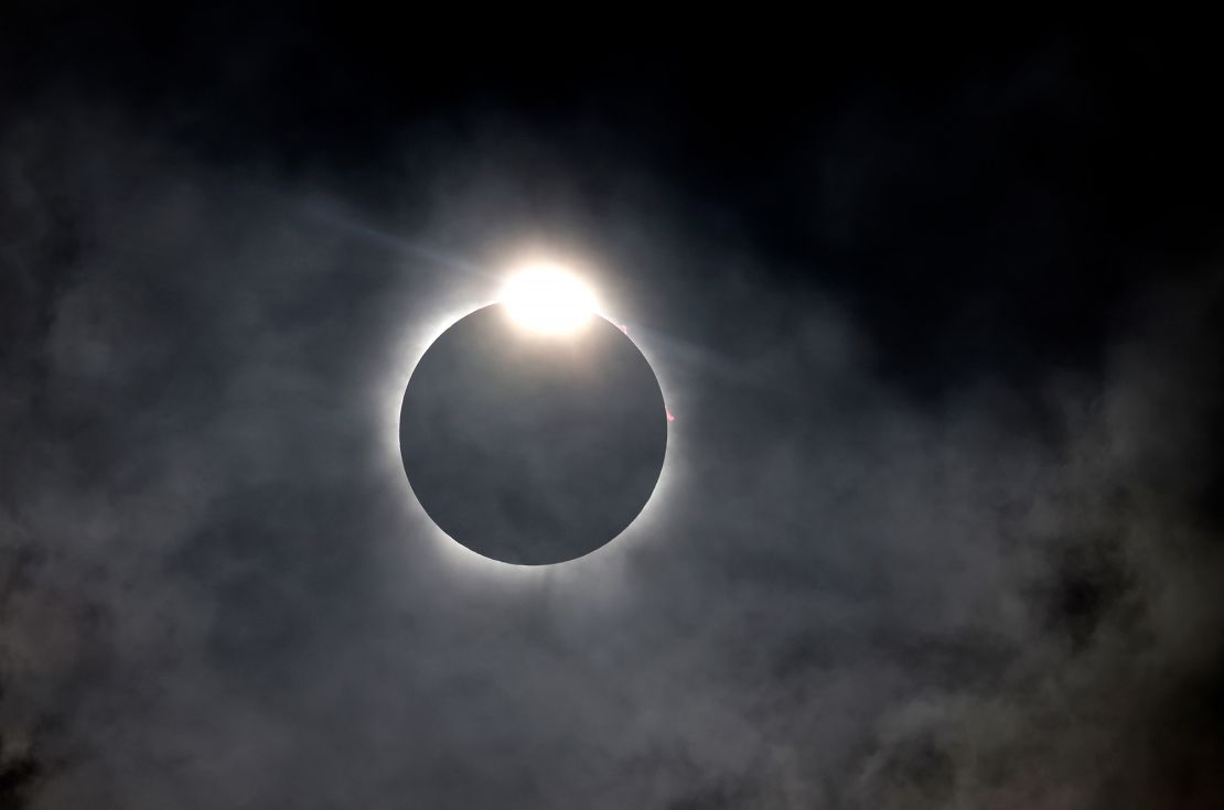 The diamond ring effect is seen as the moon eclipses the sun on Monday in Fort Worth, Texas.