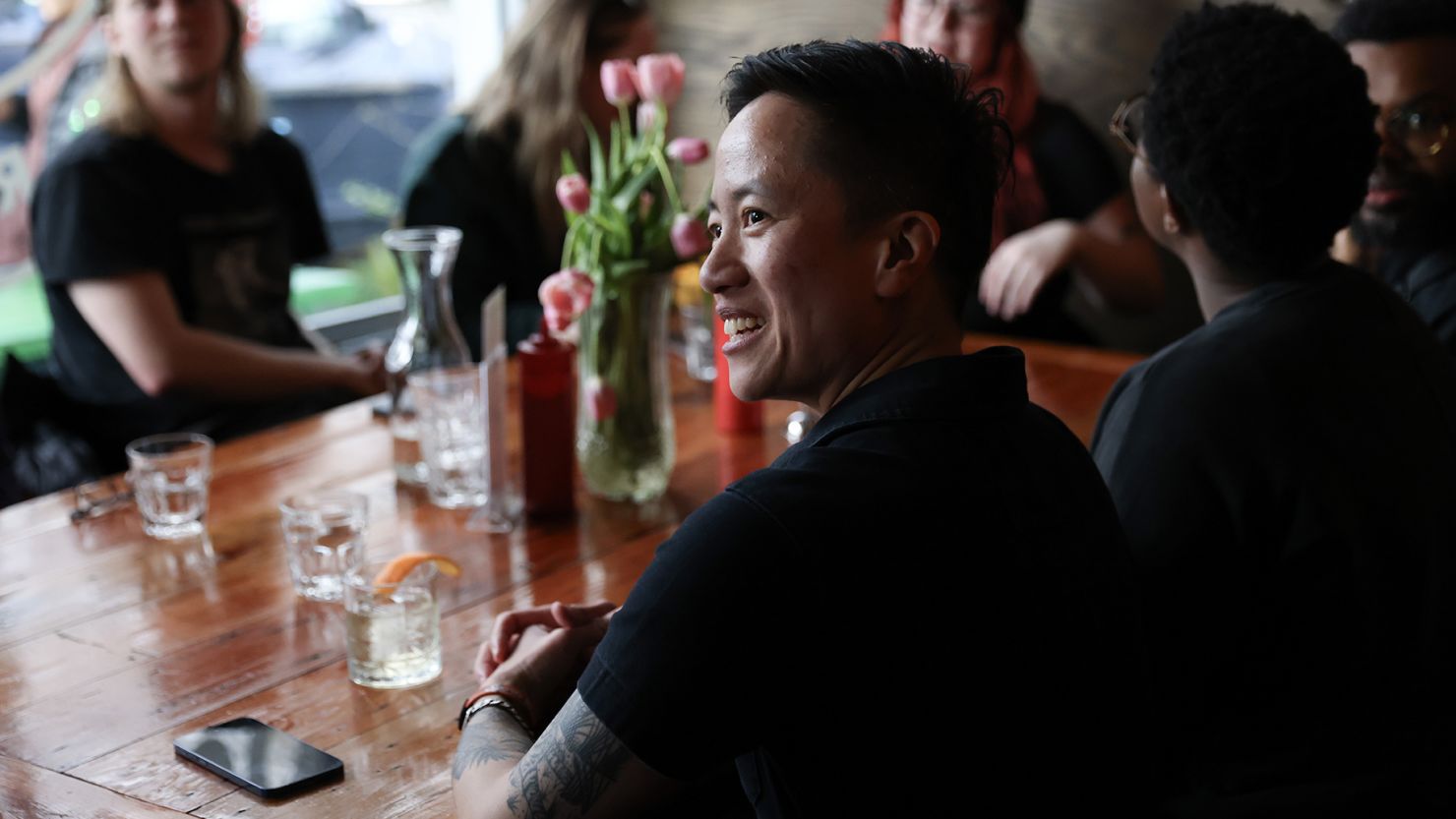 Jenny Nguyen, founder and owner of The Sports Bra, talks with patrons after the semifinal game of the NCAA Women’s Basketball Championship on April 5 in Portland, Oregon.