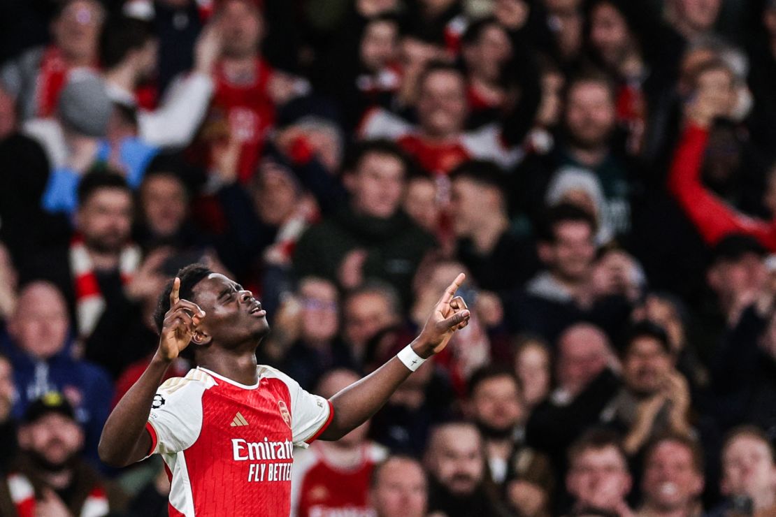 Bukayo Saka celebrates after scoring Arsenal's first goal of the game.