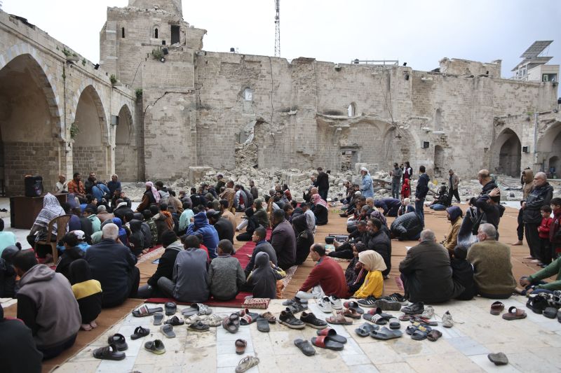 Palestinians gather at Gaza City's damaged Omari Mosque during Eid on Wednesday.
