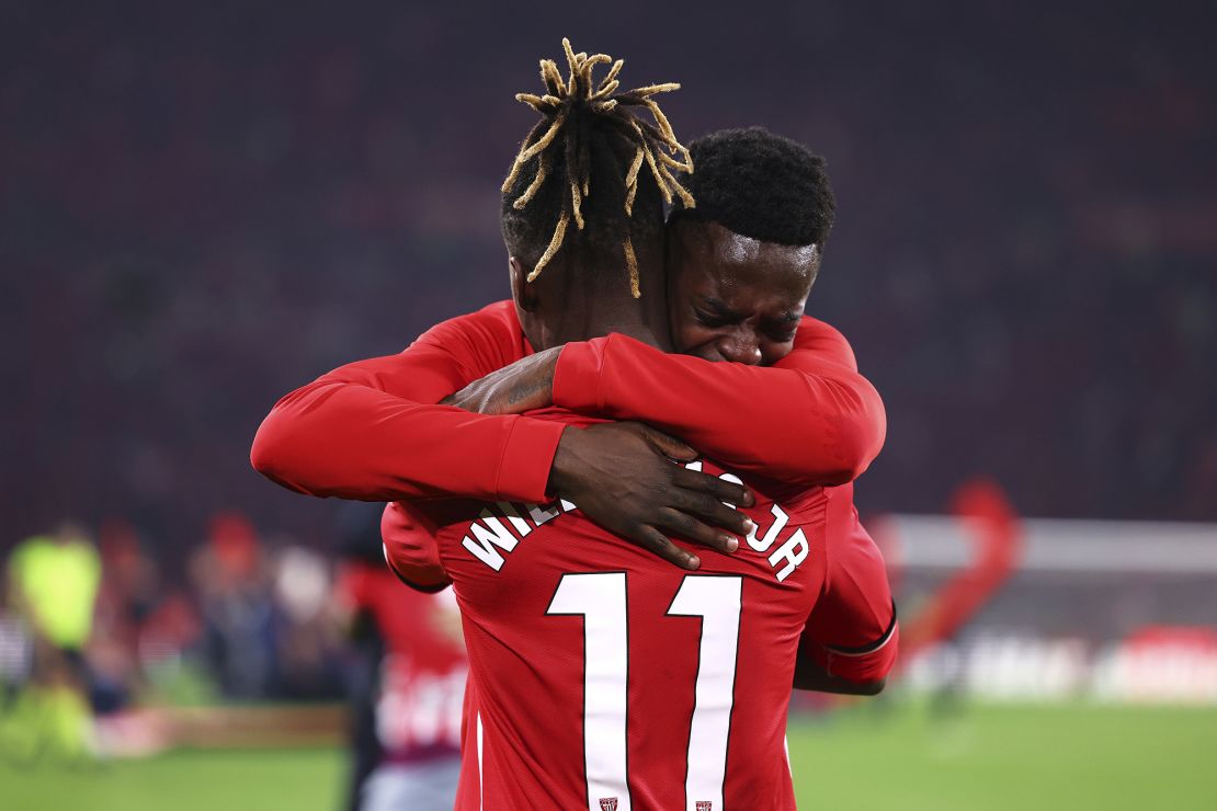 Iñaki Williams and Nico Wiliams embrace after the winning penalty shootout.